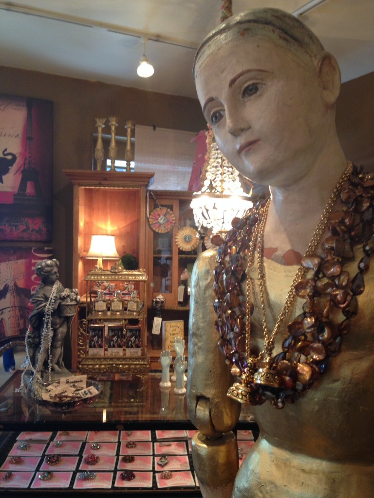 "Charming Statue Is Adorned With Lovely Jewels! Souvenir Has Many  Goodies In The Background!"